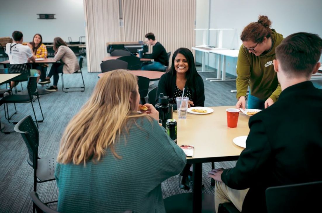 Students dining and interacting together in a vibrant dining hall