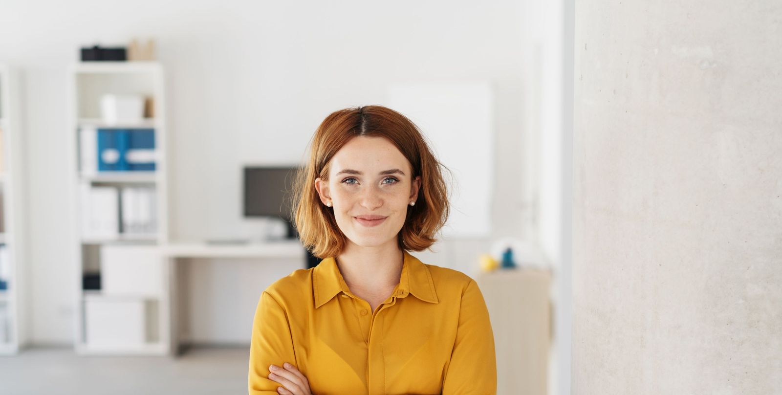 Businesswoman smiling in her modern office